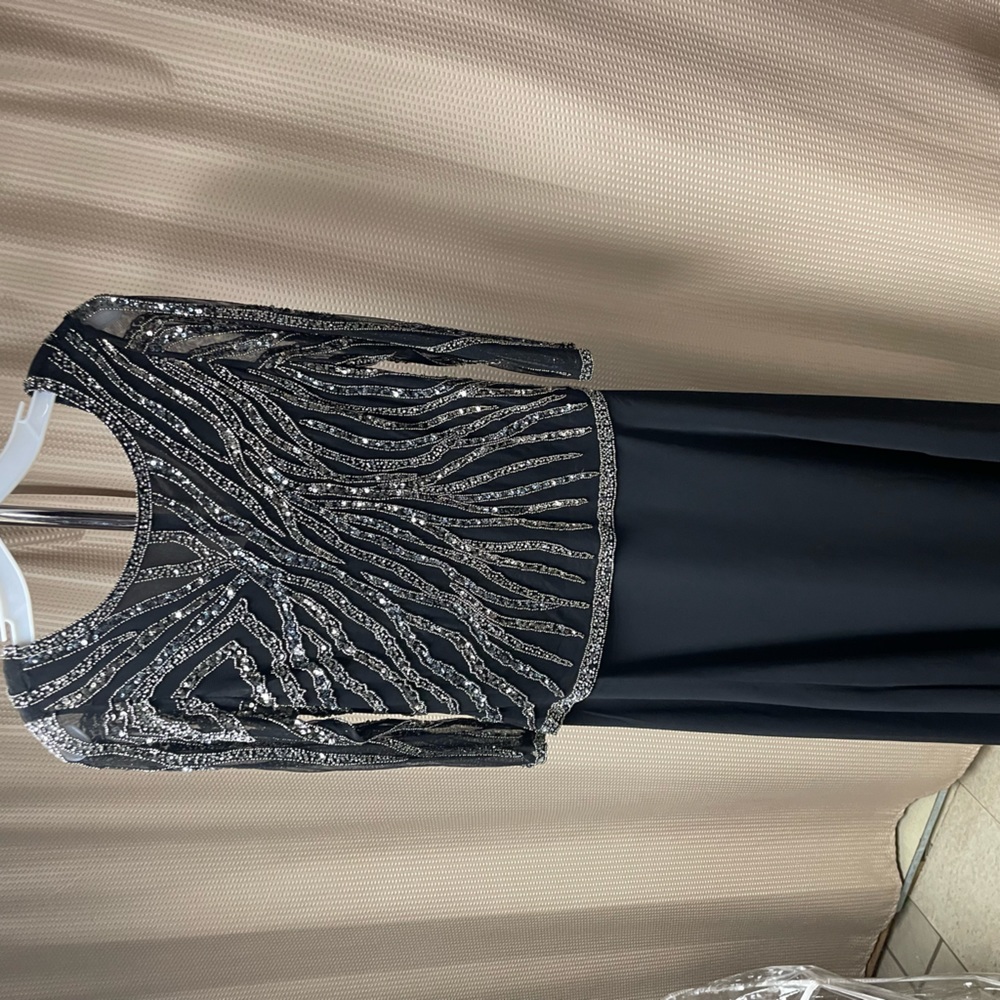 Black evening gown with silver n black embellishments, back is v , fully lined